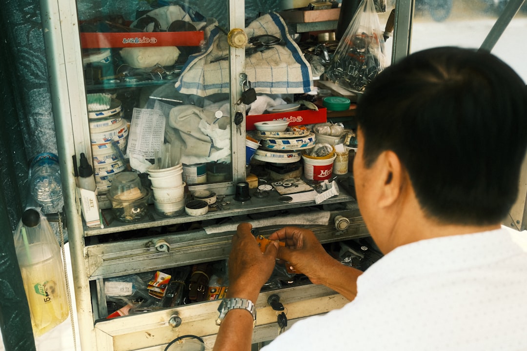 woman in white shirt sitting at the table